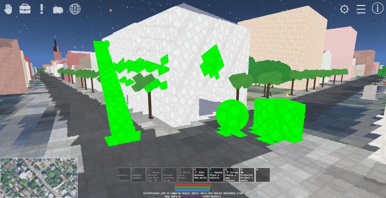 Reshaping the courthouse with voxel edits — a carved doorway, a ramp from the roof to the street, a sphere and a cube on the pavement, and painted stripes.