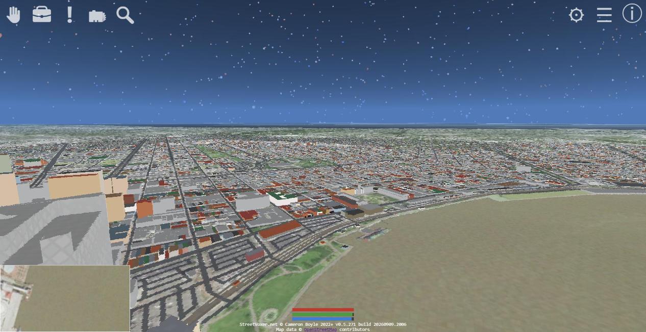 The French Quarter above the Mississippi — the river sweeping across the foreground, the wharves along the levee, the Quarter's low-rise grid running back from the waterfront.